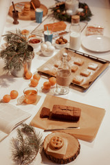 Confectionery - still life. Cookies, bakery products, tangerines, eggs. Cooking dessert and sweets. Sugar and cafe. Coffee or tea to buns. Still life with food
