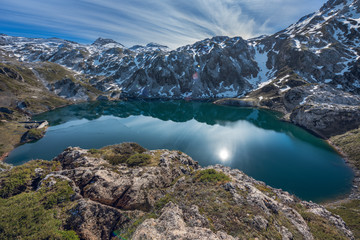 Lago de Calabazosa, Saliencia lakes in the Somiedo Nature Park, Asturias, Spain. End of winter with snowy areas in the mountains.