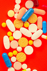 pills, different pills and drugs to treat and increase immunity, medical preparations. background top view. copy space for text