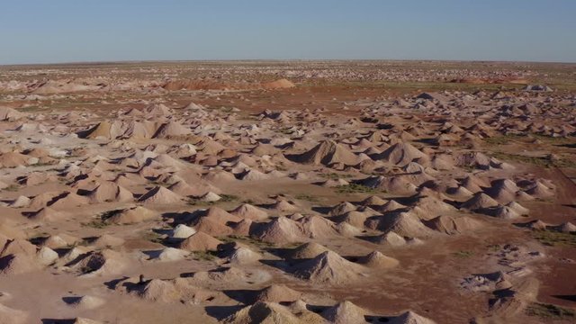 Surreal Outback Australian Opal Fields of Coober Pedy. Vast Mars Like landscape of diggings and mine shafts. Some showing aged machinery from yesteryear.