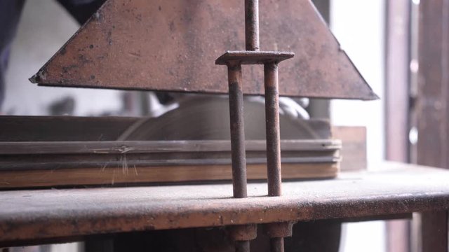 Cutting peas of wood on circular saw