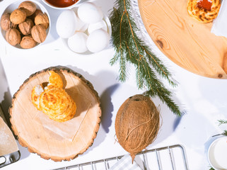 Confectionery - still life. Cookies, bakery products, tangerines, eggs. Cooking dessert and sweets. Sugar and cafe. Coffee or tea to buns. Still life with food