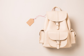 White leather backpack and blank tag (label) - fashion accessories