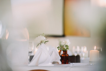 wedding decoration on tables with pharmacy glasses and candles