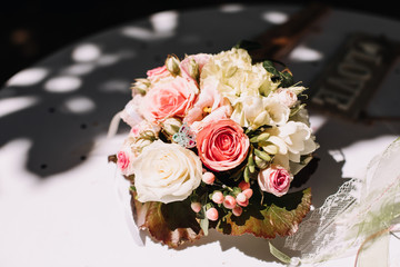 Colorful classical bouquet of flowers on soft background in sunlight