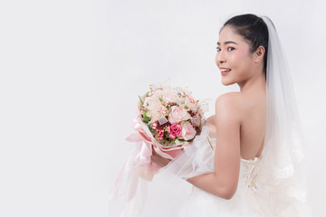 Asian woman is wearing wedding dress with free space on white background