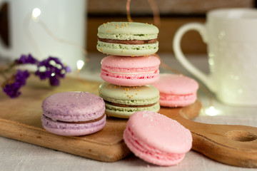 colorful macaroons on wooden table