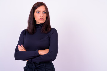 Portrait of young beautiful businesswoman with arms crossed