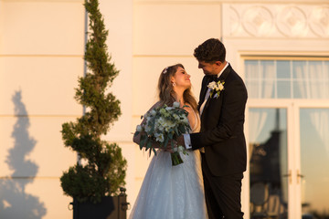 In love wedding couple posing outdoor