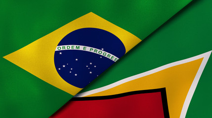 The flags of Brazil and Guyana. News, reportage, business background. 3d illustration