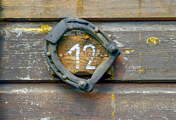 Horse shoe and number twelve