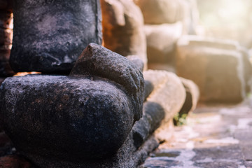 Blurred Background antique buddha pagoda statue in Thailand Ayutthaya buddhist ancient temple. Thai tourist pray for good luck, zen peaceful and holy meditation relax.