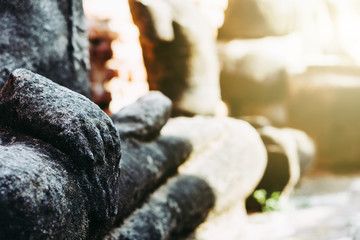 Blurred Background antique buddha pagoda statue in Thailand Ayutthaya buddhist ancient temple. Thai tourist pray for good luck, zen peaceful and holy meditation relax.