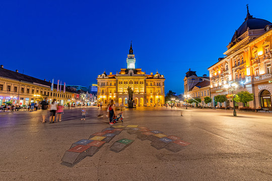Novi Sad, Serbia - July 19, 2019: Freedom Square (serbian: Trg slobode) is the main square in Novi Sad. The photo shows County government office (City house) and monument of Svetozar Miletic.