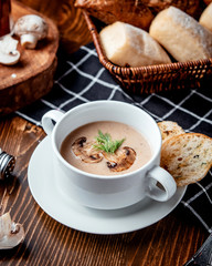 mushroom soup with bread on the table