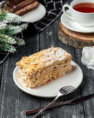 napoleon cake with black tea on the table
