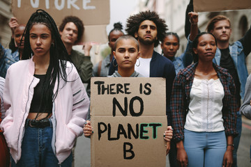 Activists doing a silent protest to save earth - obrazy, fototapety, plakaty