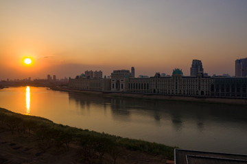 Fototapeta premium Phnompenh capital of Cambodia on the sunset with beautiful landscape by drone