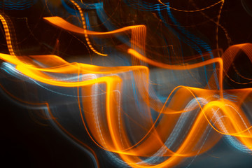 Light trail abstract blurred on a black background motion orange blue