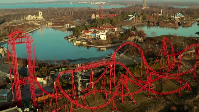 Top panoramic view over an abandoned amusement park rollercoaster
