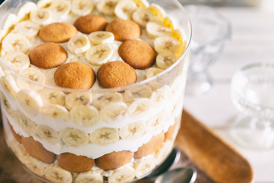Banana pudding, popular in the Southern United States, made with vanilla wafer cookies, pudding, whipped cream, and banana slices. Shown in a trifle bowl. 