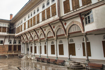 Fototapeta na wymiar The inner courtyard of the Topkapi Palace Harem in Istanbul in rainy weather. Turkey
