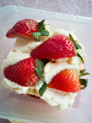 Victoria sponge cake in a container.