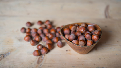 Macro photo Hazelnut nuts.Hazelnuts in a wooden bowl on rustic background