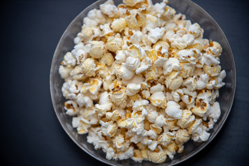 popcorn bowl from above on black background