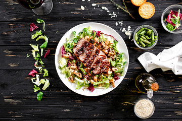 Baked meat with mushrooms on salad leaf