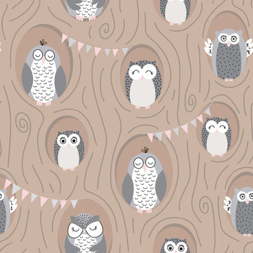 Cute vector pattern with owls in burrows in a tree