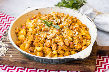 Cinnamon apples baked in pan. Sweet vegan dessert.