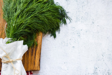 Green fresh bunch of raw dill. Copy space.