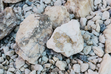 Stones of different sizes in the open air. Selective focus.
