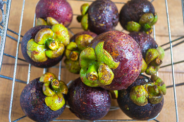 Natural fresh mangosteen, in indonesia called buah manggis . healty fruits with contains many nutrients that are good for the body. top view