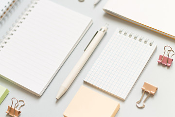 business training concept. notebooks on a blue background close-up clips and pens, stickers and stationery