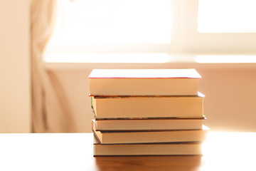 close up of a stack of books on the table