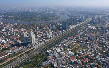 Top view aerial photo from flying drone of a Ho Chi Minh City with development buildings, transportation, energy power infrastructure
