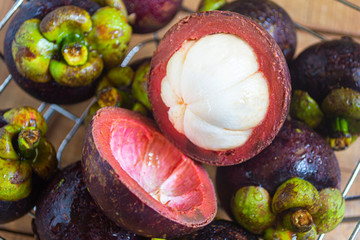 Natural fresh mangosteen, in indonesia called buah manggis . healty fruits with contains many nutrients that are good for the body. top view