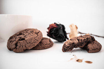 Chocolate chip cookies are on the white table