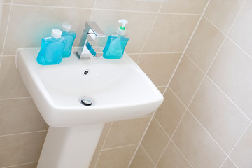 Anti bacterial blue hand wash on hand basin to prevent coronavirus and other germs or virus