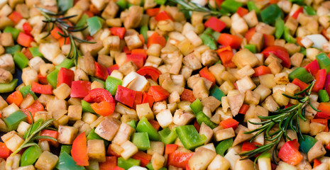 zucchini and other vegetables cooked on a board in the garden