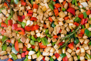 zucchini and other vegetables cooked on a board in the garden