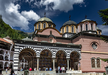 Facade view of the Rila Monastery with tourists