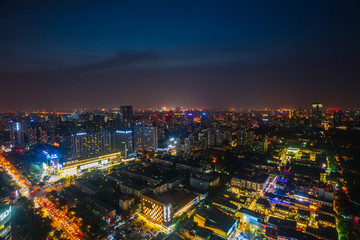 Obraz premium Futuristic city at night. Many high-rises and neon signs.