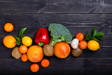 Vegetables and fruits to maintain immunity on a black background. Copy space