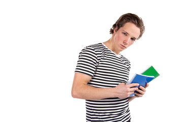 Young attractive student and textbooks. White background.