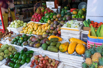 Fototapeta na wymiar Pile of exotic fruits, mango, pineapple at a market in Vietnam