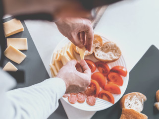 close up. man making sandwiches in the kitchen
