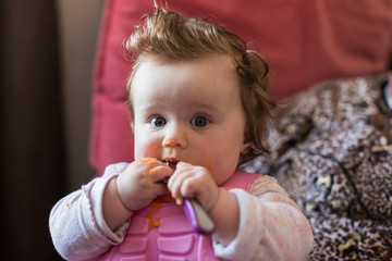 hungry baby with spoon and puree